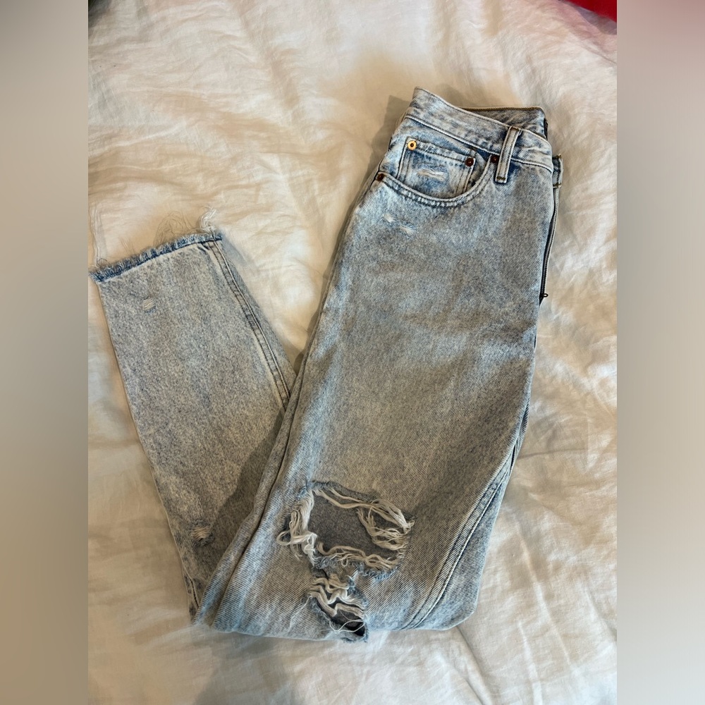 High-rise mom jeans; ripped acid wash